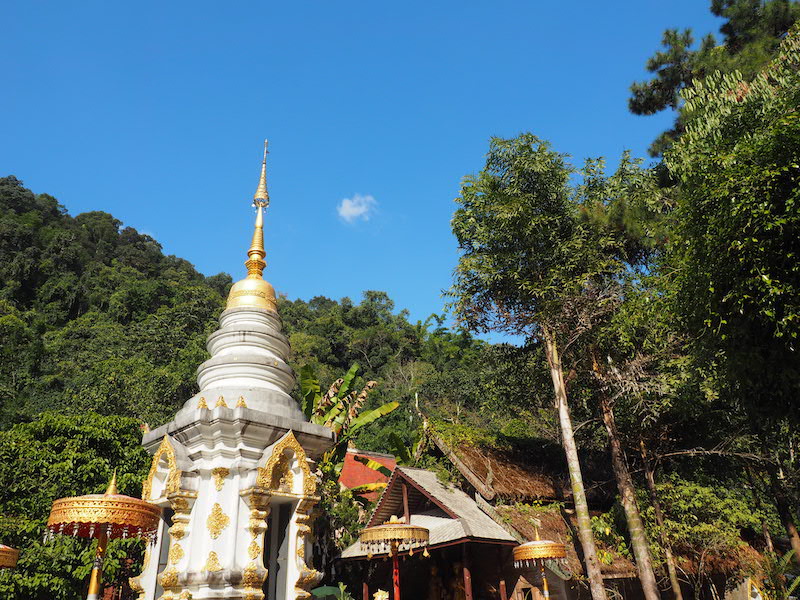 White chedi with blue sky Mae Kampong Village
