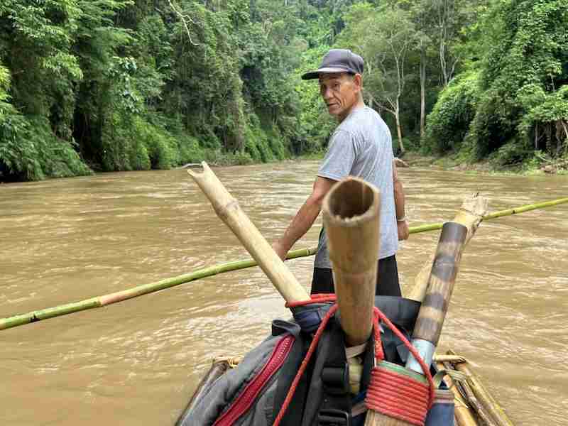 Man on a bamboo raft